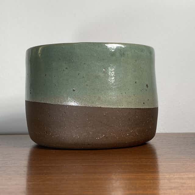Plant pot with brown clay and sea green glaze