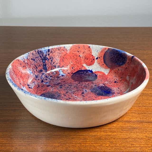 Orange and blue dotted bowl