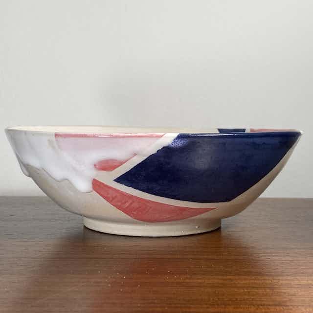 Wide shallow pink, blue, and white bowl