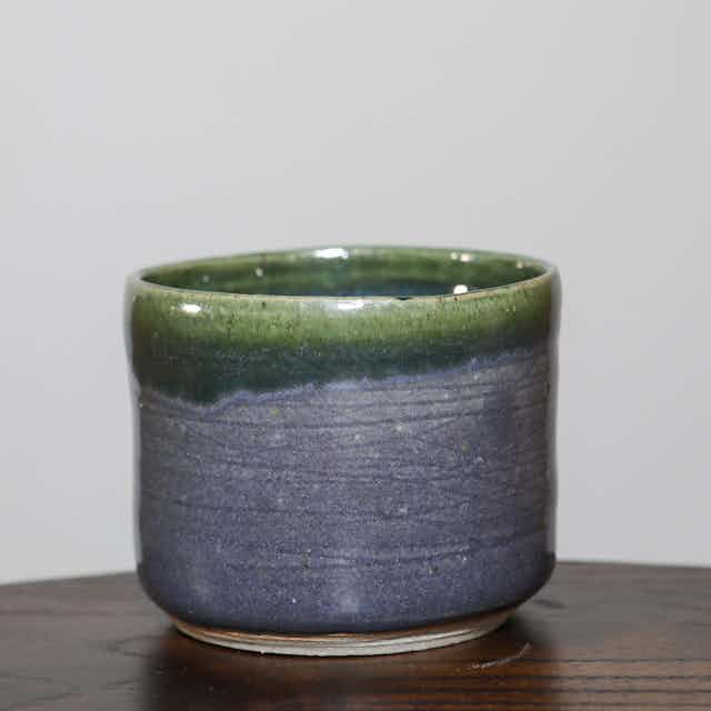 Grey + green lined cylinder
