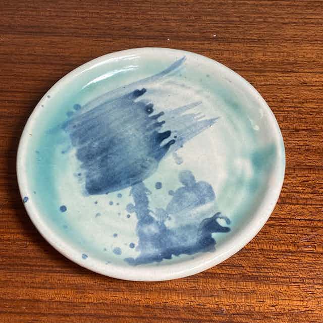 Small painted blue plate