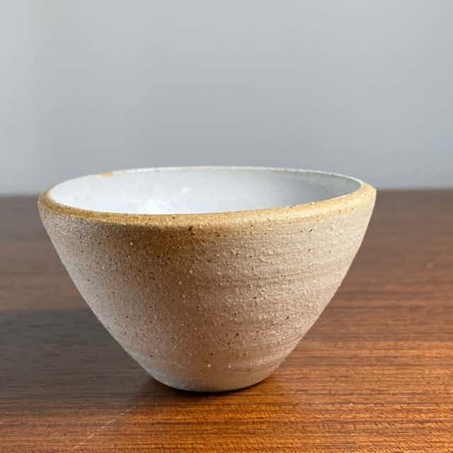 Tiny white bowl with s-crack